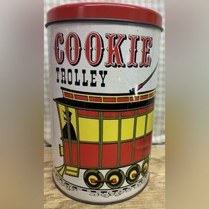 VINTAGE BALLONOFF 7 3/4” tall x 5 1/4” D COOKIE TROLLEY TIN.‎